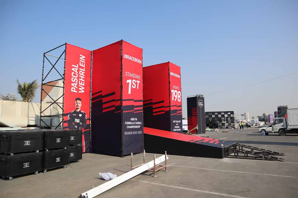 Scaffold towers and branded structures at Icons of Porsche, Dubai Design District