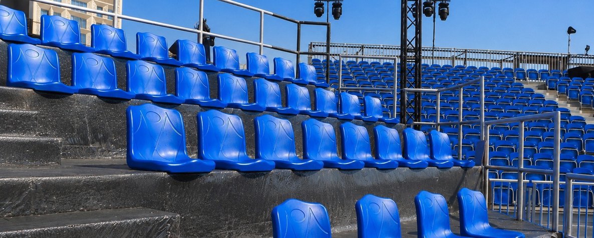 Blue bucket seats on a grandstand