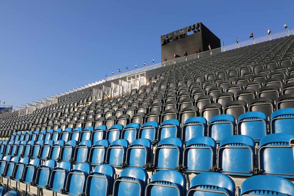 Grandstand with blue bucket seating by Apex Events